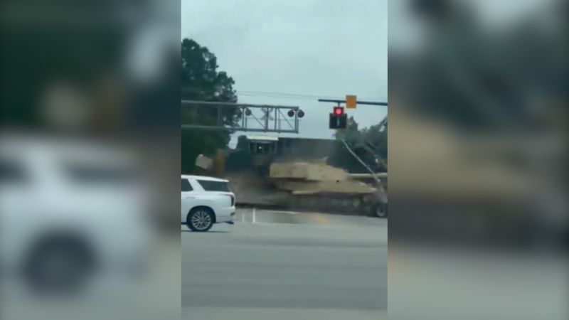 Watch: Train smashes into a semi-truck hauling an armored vehicleWatch: Train smashes into a semi-truck hauling an armored vehicle 